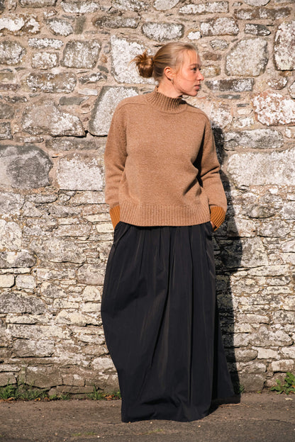 Maree knit is made with the finest Scottish spun lambswool. Knitted in a chunky luxurious 4 ply yarn with a funnel neck, contrast cuffs and a boxy, oversize fit. Traditionally made with fully fashioned knitting techniques and linked together by hand. Crafted within 80 miles of our design studio in the Scottish Borders.